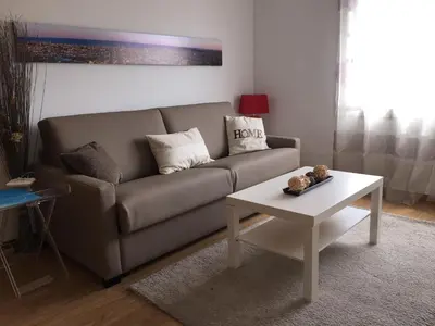 a living room with a couch and a table at Luxury Apartment Barcelona in Barcelona