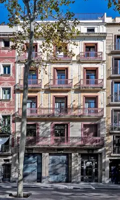 a large building with balconies on the side of it at Aparthotel Rambla108 in Barcelona