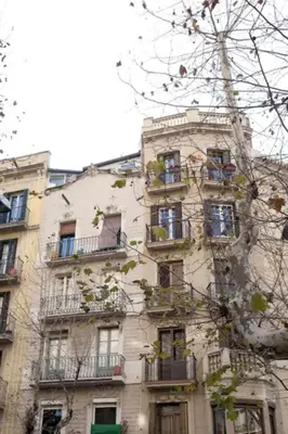 a tall building with balconies on the side of it at Best deal PENTHOUSE! in Barcelona