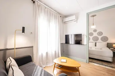 a living room with a couch and a table at Sweett - Rosemarine in Barcelona