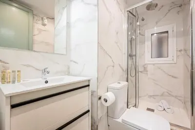 a bathroom with a sink and a toilet and a shower at Sweett - Rosemarine in Barcelona