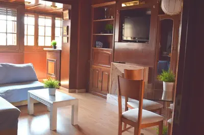 a living room with a couch and a table at Duplex Berlin 87 in Barcelona