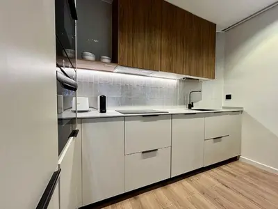 a kitchen with white cabinets and a sink at BarcelonaForRent Plaza Sagrada Familia in Barcelona