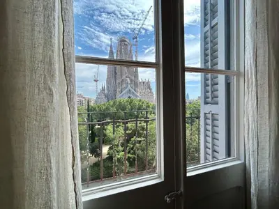 an open window with a view of a building at BarcelonaForRent Plaza Sagrada Familia in Barcelona