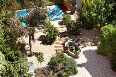an overhead view of a garden with a swimming pool at Villa Modernista in Barcelona