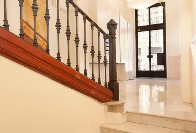 a staircase in a house with a stair case at En Casa de Girona 17 in Barcelona