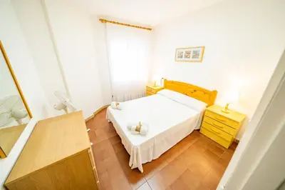 a kitchen with a sink and a microwave at HomeHolidaysRentals Sol in Pineda de Mar
