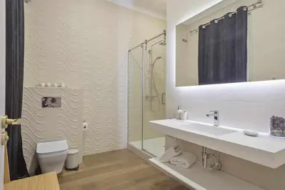 a bathroom with a sink and a shower and a toilet at Apartment Lucia in Barcelona