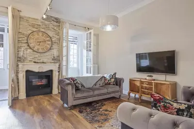 a living room with a couch and a fireplace at Apartment Lucia in Barcelona
