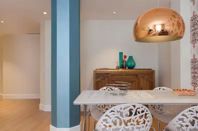 a dining room with a table and chairs at Passeig de Gracia Apartment in Barcelona