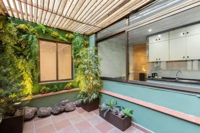 a kitchen with plants on the side of a building at Apartamentos DV in Barcelona