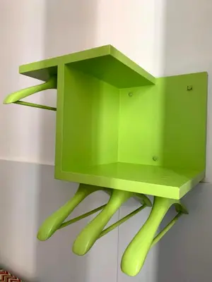 a green cabinet with four legs on a wall at Central and Basic Universitat for YOUNG HOSTEL in Barcelona