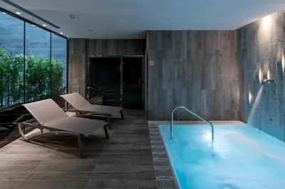 a swimming pool on the roof of a building at Catalonia Magdalenes in Barcelona