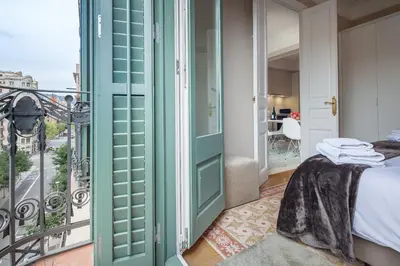 a room with a bed and a balcony at Habitat Apartments Barcelona Classic in Barcelona