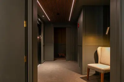 a hallway with a chair and a hallway with a corridorngthngthngthngthngth at Hotel La Pau in Barcelona