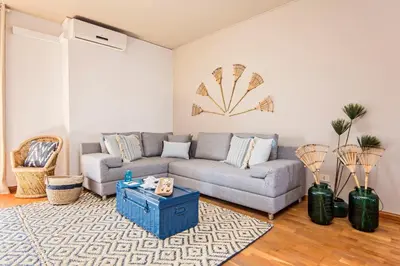a living room with a couch and a table at Sweett - Villa Olimpica Mediterranean in Barcelona