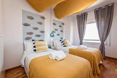 a bedroom with two beds with towels on them at Sweett - Villa Olimpica Mediterranean in Barcelona