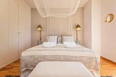a bedroom with a large bed with two white pillows at Sweett - Villa Olimpica Mediterranean in Barcelona