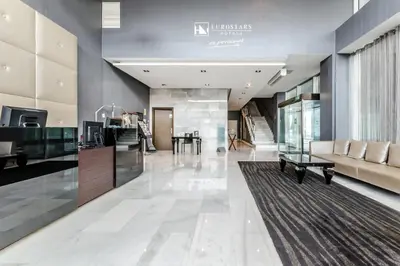 a lobby of a building with a couch and a table at Eurostars Executive in Barbera del Valles