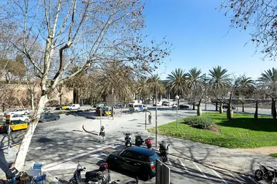 a parking lot with a car parked in a park at Yomo Hostal BCN Port in Barcelona