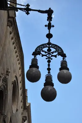 a street light hanging from the side of a building at Hostal Fernando in Barcelona