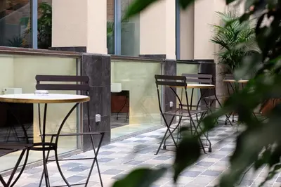 a group of tables and chairs on a patio at Chi in Barcelona