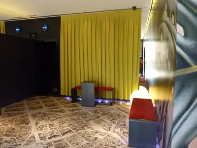 a room with a yellow curtain and a red bench at Barcelona House in Barcelona