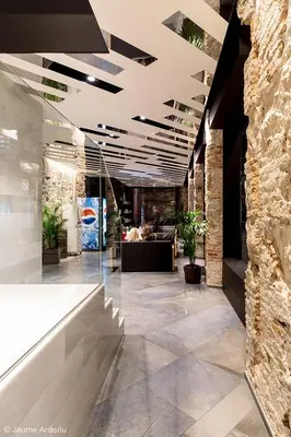 a lobby with a reception desk in a building at Barcelona House in Barcelona