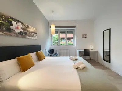 a bedroom with a large white bed with two stuffed animals on it at Stay U-nique Apartments Sants in Barcelona