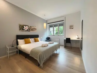 a bedroom with a bed and a desk at Stay U-nique Apartments Sants in Barcelona