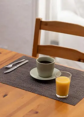 a cup of coffee and a glass of orange juice on a table at Ally's Bed&Breakfast, in Barcelona