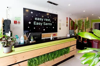 a store with a large tv on the wall at Easy Sants by Bossh! Hotels in Barcelona