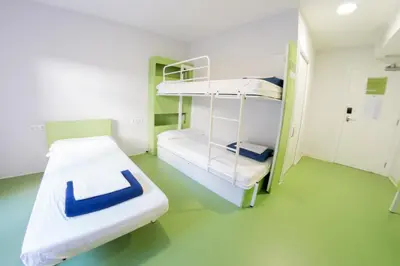 a hospital room with two bunk beds in it at Sant Jordi Hostels Sagrada Familia in Barcelona