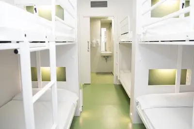 a hallway with bunk beds in a dorm room at Sant Jordi Hostels Sagrada Familia in Barcelona