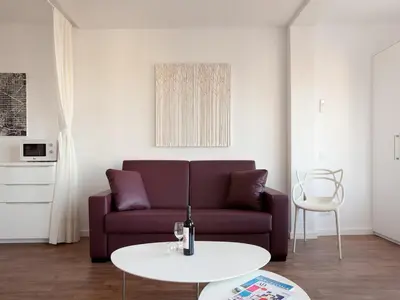 a living room with a couch and a table at Stay U-nique Apartments Sant Pau in Barcelona