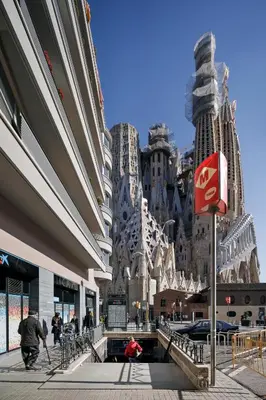 a group of people walking in front of a building at Hotel Sagrada Familia Apartments in Barcelona