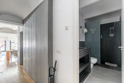 a bathroom with a toilet in a room at Super central 3BR apartment, spacious and bright in Barcelona