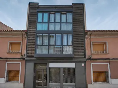 a building with glass windows on the front of it at Matarolux 6 in Mataró
