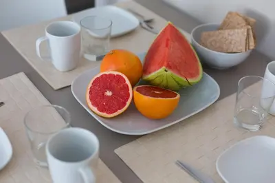 a plate of fruit sitting on a table at Flateli 430 BCN in Barcelona
