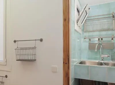 a bathroom with a sink and a mirror at Ndlr 2-4 · Authentic flat in Poble Sec - Paralelo in Barcelona
