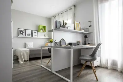 a desk and a chair in a room with a bed at Residencia Universitaria Resa Barcelona Diagonal in Barcelona