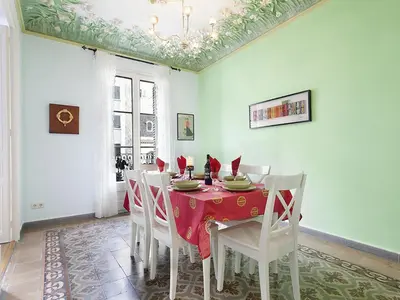 a dining room with a red table and white chairs at Apartment in Barcelona near Passeig de Gràcia in Barcelona