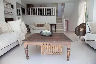 a living room with a coffee table and a couch at New Opening Villa Oasis Terramar in Sitges