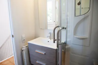 a bathroom with a sink and a mirror at New Opening Villa Oasis Terramar in Sitges