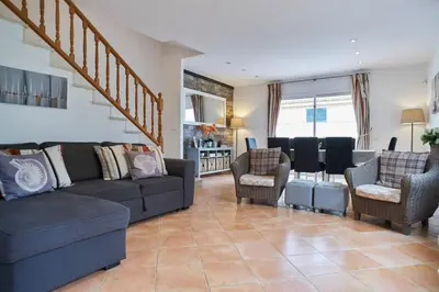 a living room with a couch and chairs at Casa Garcia in Sitges