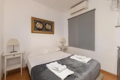 a bedroom with a bed with towels on it at Rambla Cat · Penthouse with terrace in Barcelona