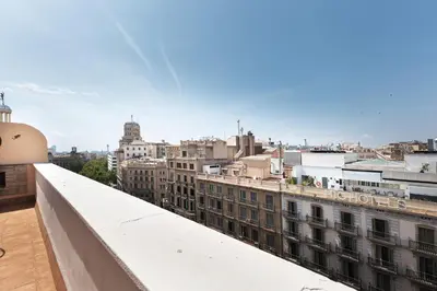 a view of the city from the roof of a building at Rambla Cat · Penthouse with terrace in Barcelona