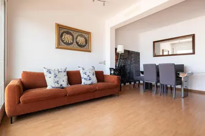 a living room with a couch and a table at Rambla Cat · Penthouse with terrace in Barcelona