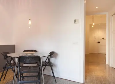 a dining room with a table and chairs at Napoles · Modernist flat close to Sagrada Familia in Barcelona