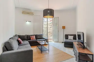 a living room with a couch and a table at 2215 - AB Calabria Apartment in Barcelona